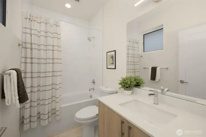 Full bath across from guest bedroom.