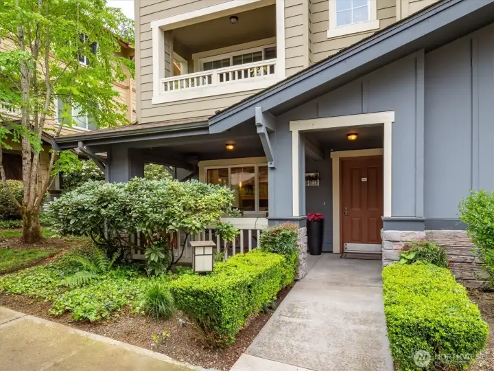 Private corner unit with covered access, level entry, everyday convenience right from the start.