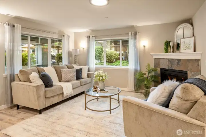 Spacious living room filled with natural light and warm, inviting tones.