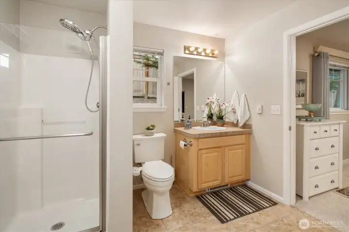 Ensuite bathroom with walk-in shower,  clean finishes and practical layout.