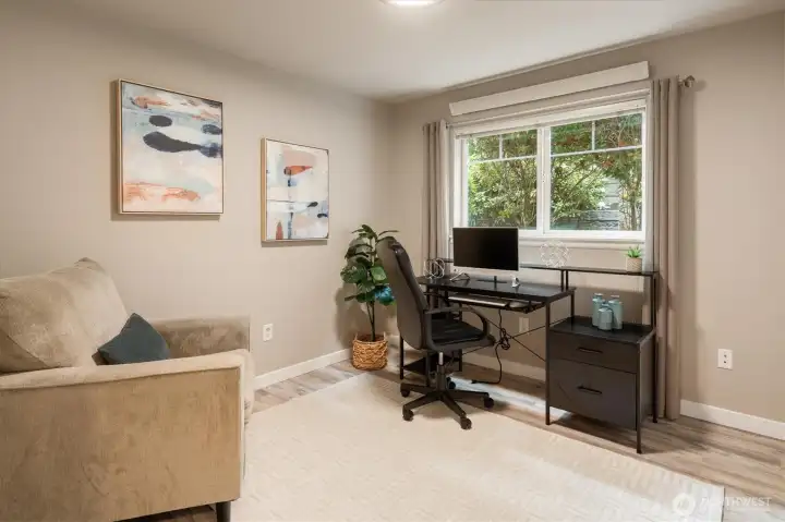 Flexible room ideal for a home office, reading nook, or additional bedroom.