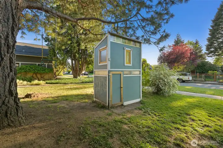 Playhouse resides between the two houses and can easily be removed if wanted.