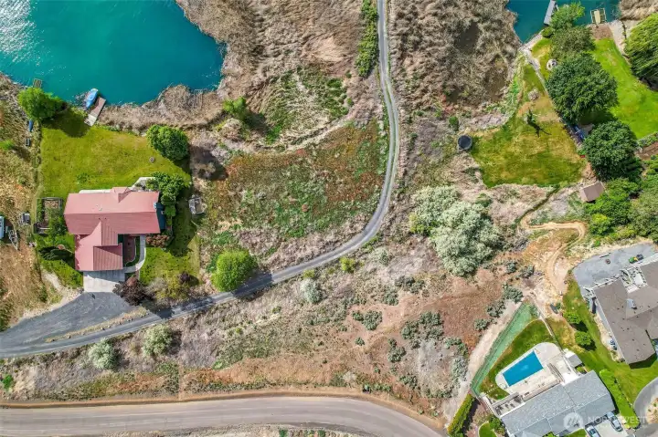 In the middle of this photo, the property is the right half of the area to the left of the gravel road, comes up the embankment up to Goodrich Road, and also includes part of the property to the right of the road. (See map) In the middle of this photo, the property is the right half of the area to the left of the gravel road, comes up the embankment up to Goodrich Road, and also includes part of the property to the right of the road. (See map)