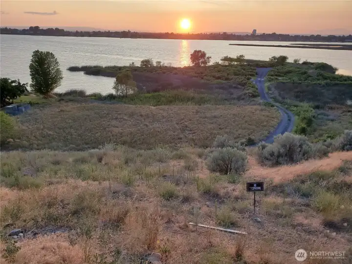 The property has corners marked. It is mostly half of the area to the left of the gravel road, and comes up this embankment. The property has corners marked. It is mostly half of the area to the left of the gravel road, and comes up this embankment.