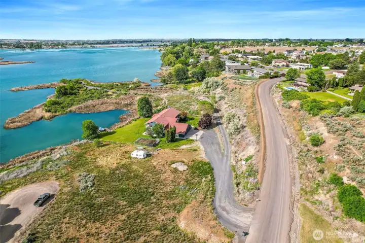 The property is on the other side of the house with the red roof. Access is via the gravel driveway. The property is on the other side of the house with the red roof. Access is via the gravel driveway.