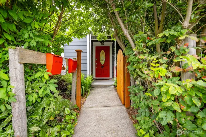 Step inside the gate to this magical garden bungalow!