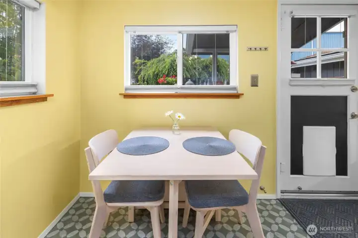 Sweet and sunny breakfast nook! Door leads to the wonderful gardens.