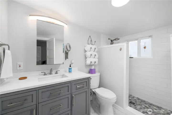 Beautifully updated primary ensuite bathroom with walk-in tile shower and tub. Everything fresh, clean and new!