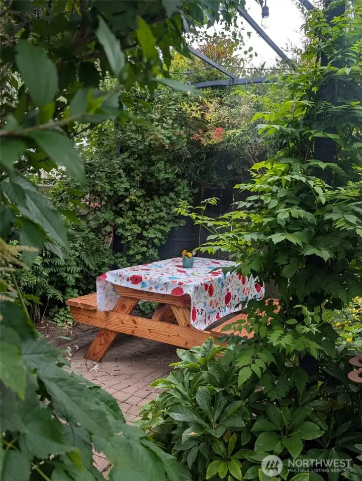 Quaint picnic patio tucked in a secret garden!!