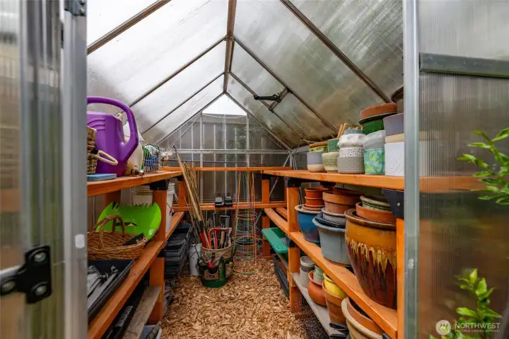 Grow your plantings even in the winter in this delightful greenhouse.