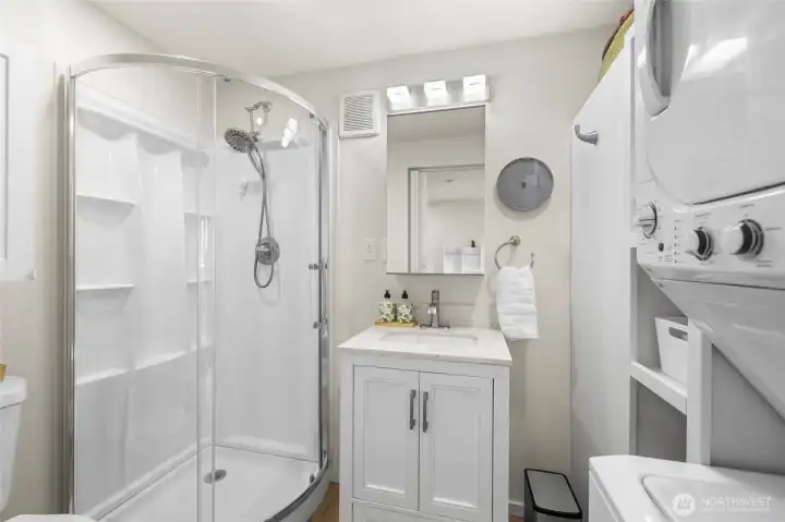 Look at this beautiful bathroom with it's own laundry!!