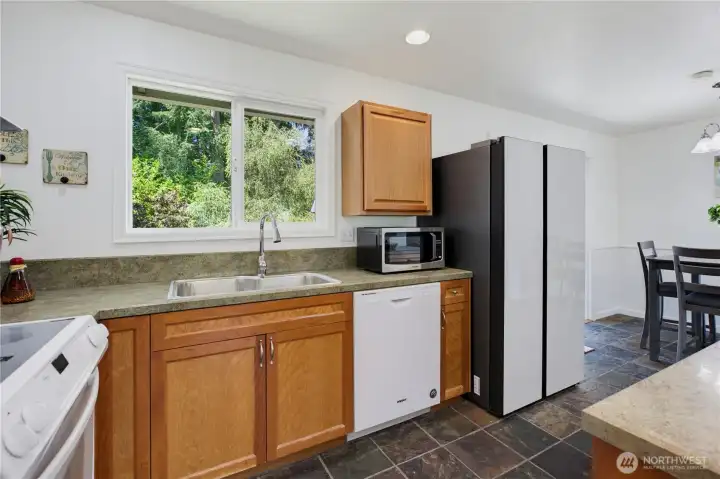 Kitchen with Back Yard Views of the Secluded Green Belt Kitchen with Back Yard Views of the Secluded Green Belt