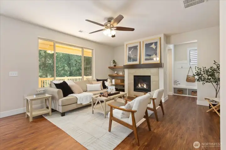 Great room with deck beyond and hall mud room to the right