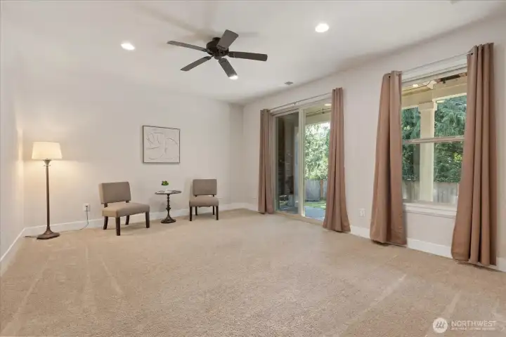 Daylight basement living area with access to patio
