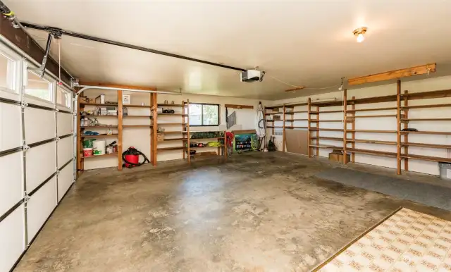 Main Level 2 car Garage, with washer and dryer, and a TON of storage space.