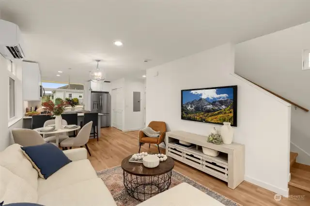 This living room has a thoughtful layout, which extends directly into the dining and kitchen areas, keeping everyone connected.