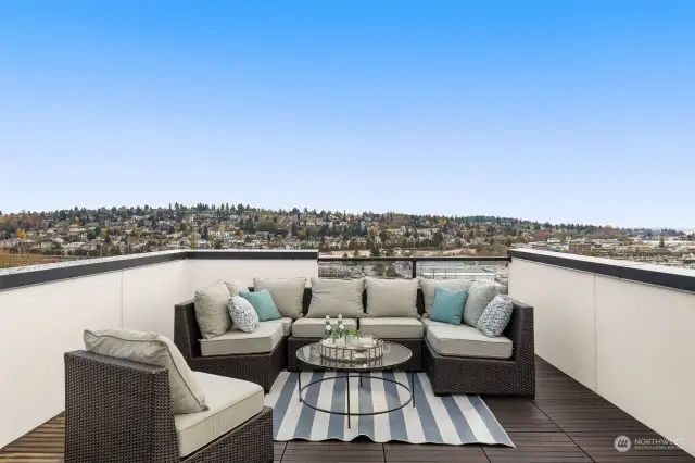 Your outdoor living dreams come true with this beautifully furnished rooftop deck. Relax with friends, enjoy the stunning views, and let every sunset feel like a vacation.