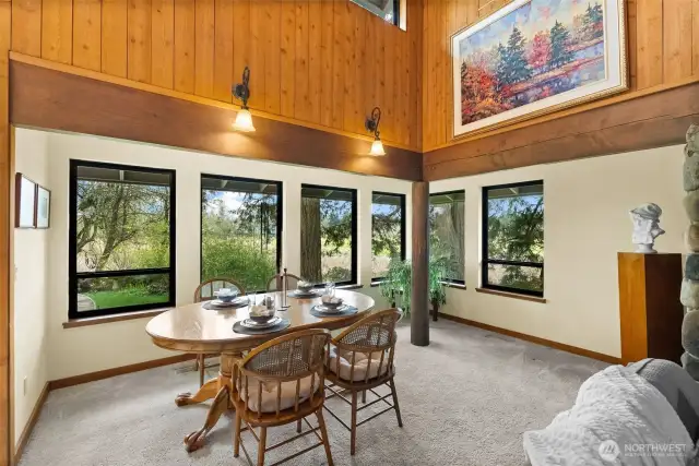 Formal dining opens to family room and has stunning views of nature