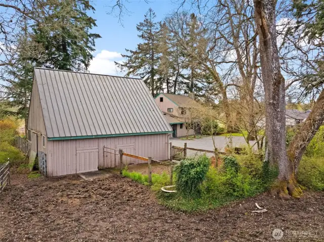 Large barn with water and electric, 2 horse stables and plenty of storage