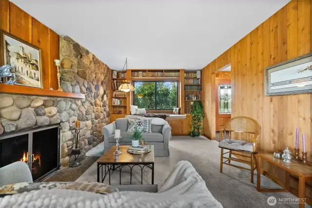 Family room with bench seating, a stone wood fireplace - so cozy!