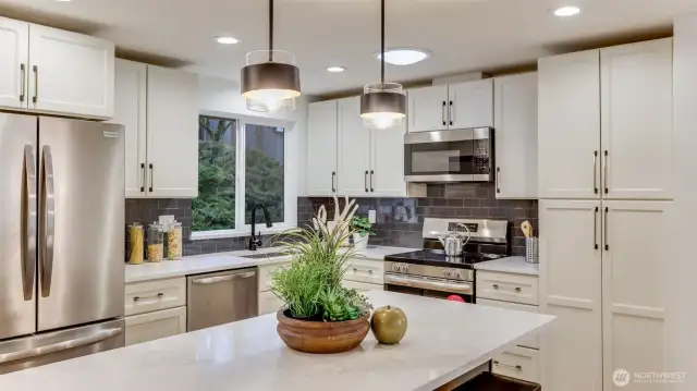 Enjoy ample cabinet space and pantry in this kitchen.