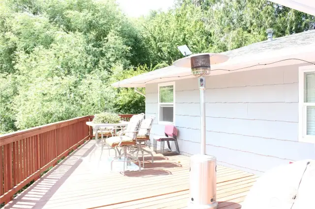 large deck overlooking the creek and outdoor space