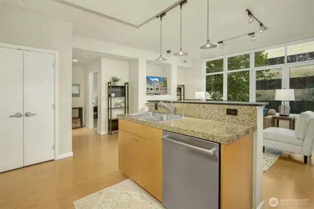 Hall to a second bed and bath is seen to the left of the fireplace.