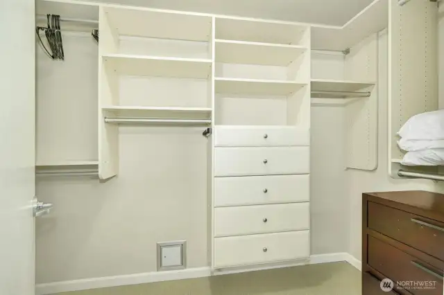 Huge walk in closet and custom built ins, including drawers