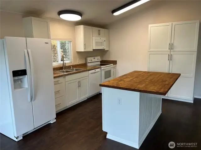 Kitchen with island, pantry and eating area.