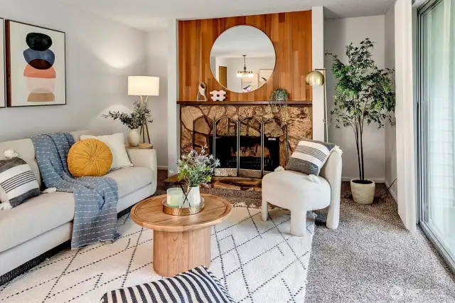 Natural wood and a stone surround to the fireplace offer a warm, cozy setting