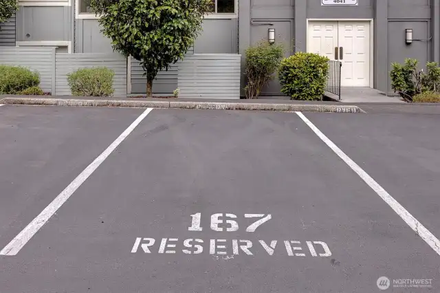 One reserved parking place #167 right outside the front door
