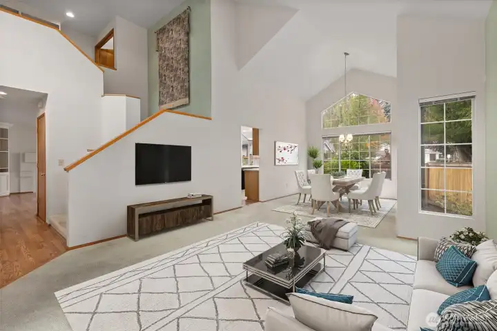 SPACIOUS LIVING ROOM W/ VAULTED CEILING AND OPEN LAYOUT. PERFECT FOR GREETING GUESTS.