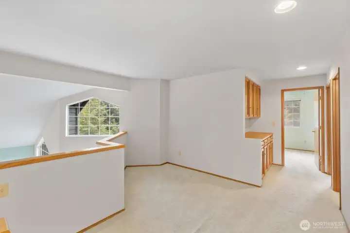 CHARMING LOFT HALLWAY FROM PRIMARY BEDROOM. PROVIDES PEACEFUL ELEGANCE.