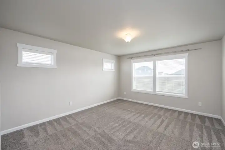 Primary Suite overlooks backyard