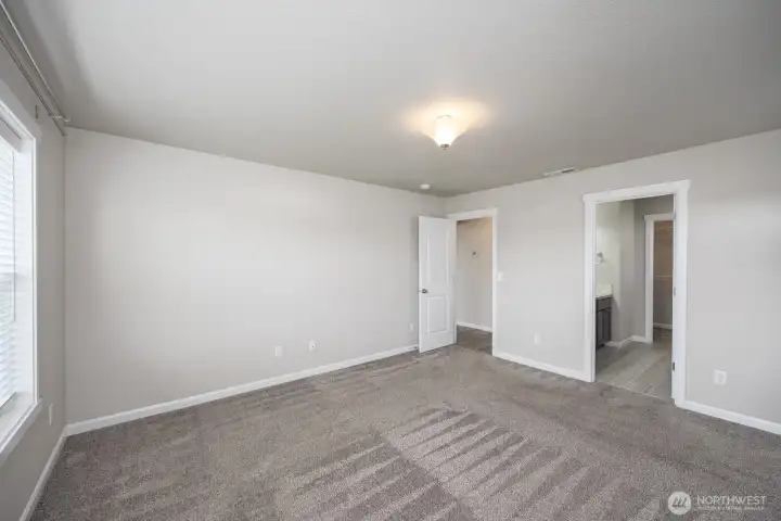 Another view of primary bedroom