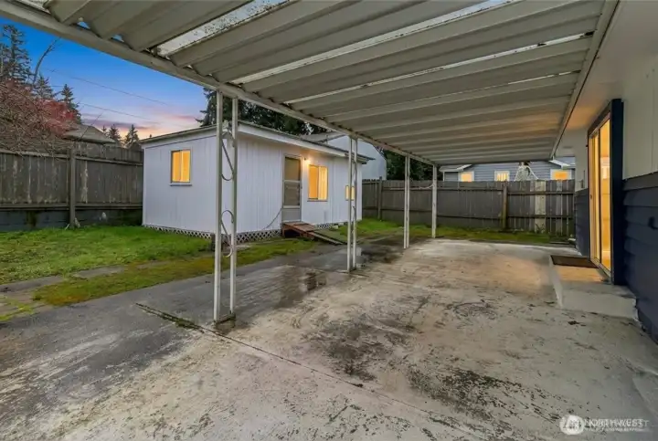 Covered porch & outbuilding. *exterior enhanced*