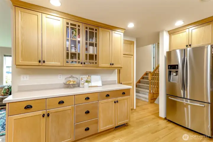 The spacious kitchen has a pantry, pictured on the right of this counter top. The stainless steel, French door fridge with bottom load freezer will convey!