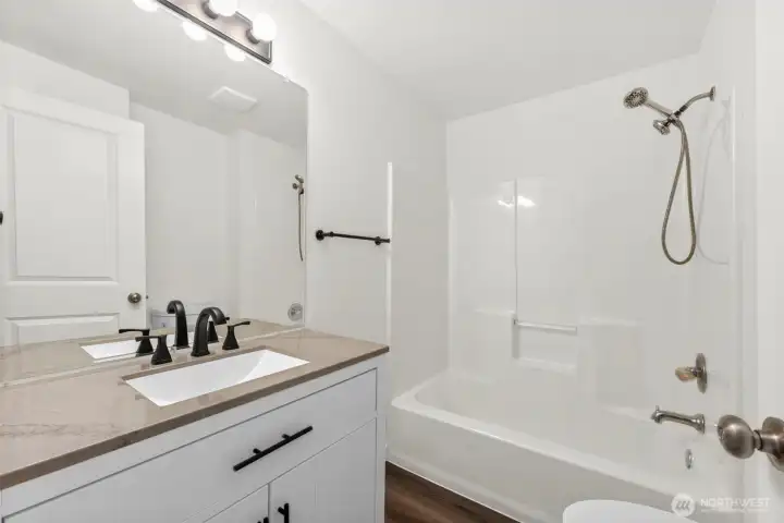 Full Guest Bath w/ New Stone Top Vanity, Toilet, Fixtures, & Easy Care LVP Flooring!