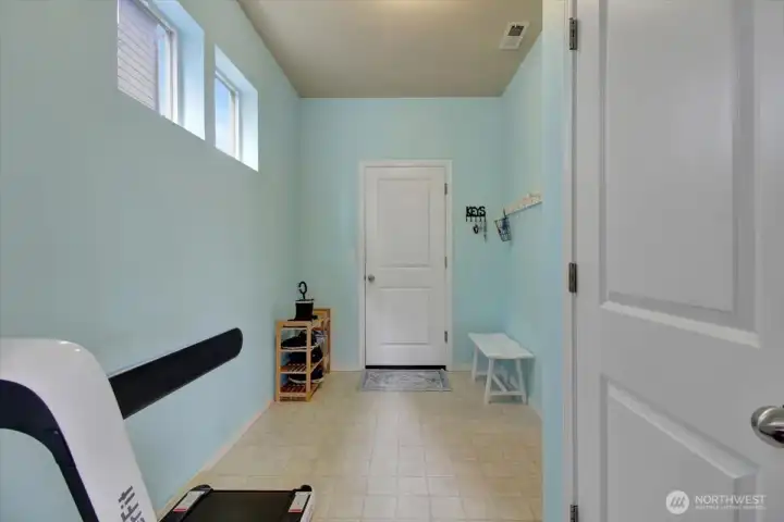 Huge mudroom between the kitchen and the garage could be built out with additional storage for coats/shoes/backpacks.  Currently used as an exercise room (fits a treadmill!).