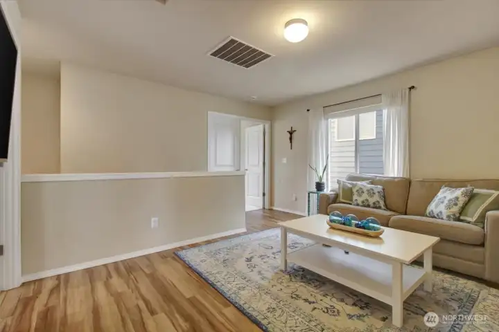 Primary suite is through the double doors.  No bedrooms share a wall!