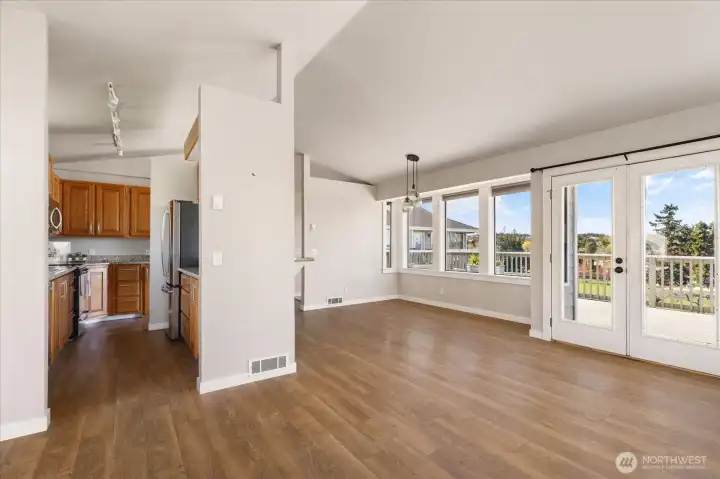 The kitchen is accessible from the living space as well as from the entry.