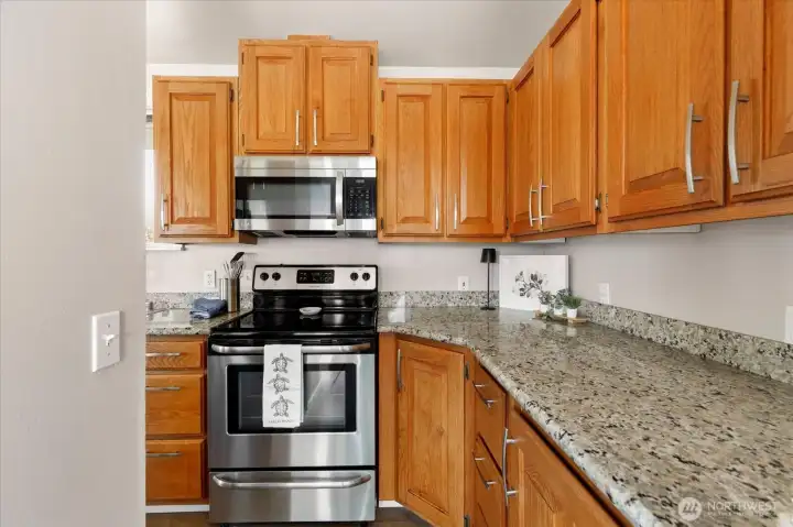 View from foyer into kitchen. Lots of counter space and storage.
