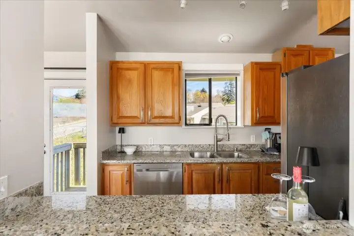 Enjoy cooking and still being a part of the conversation, with this pass-through bar