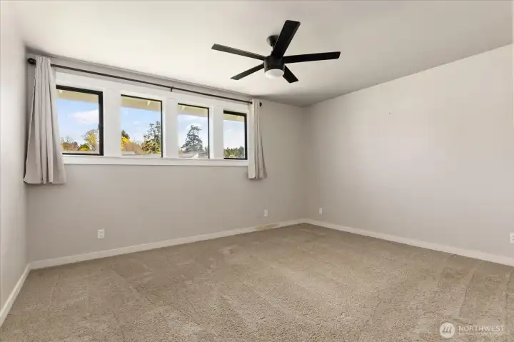 Primary bedroom. Remote controlled contemporary fan/light for cooling in summer