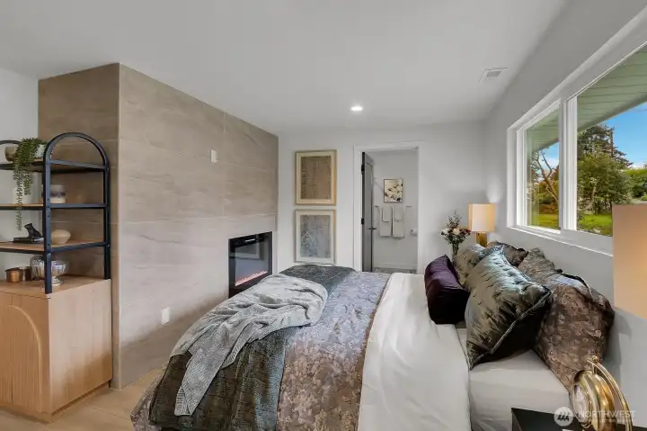 Primary Suite has Built in Fireplace with Tile Surround