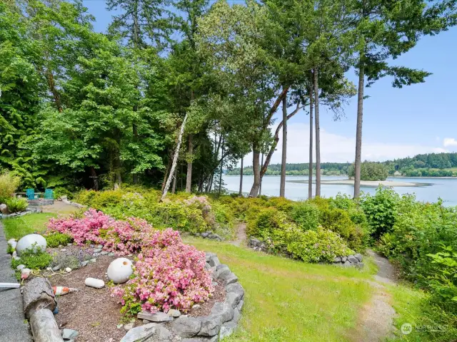 Native landscaping, fire pit, seating and beach access just minutes from your door