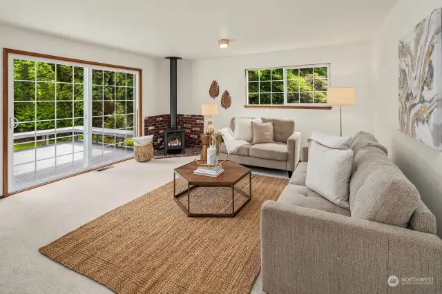 A generous family room with cozy wood stove is ready for movie nights and play dates.