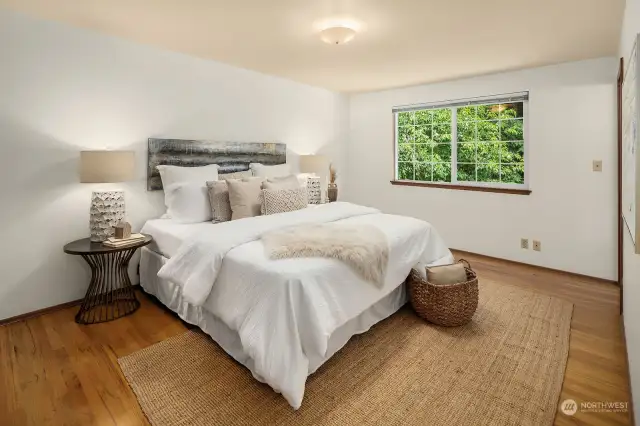Retreat to the owner's suite boasting peaceful backyard views and a private en-suite bathroom.
