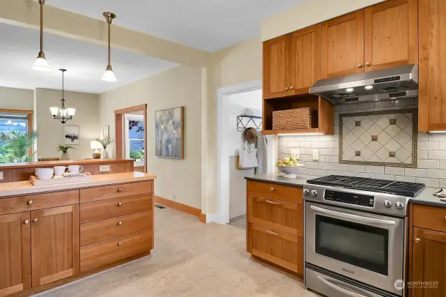 Loads of storage in this large open kitchen with breakfast bar, adjacent to dining area--perfect for entertaining!