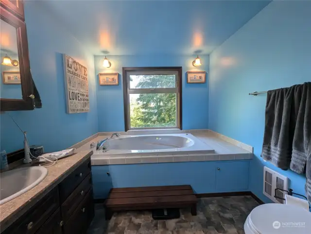 Primary bath with private views from the jetted tub.